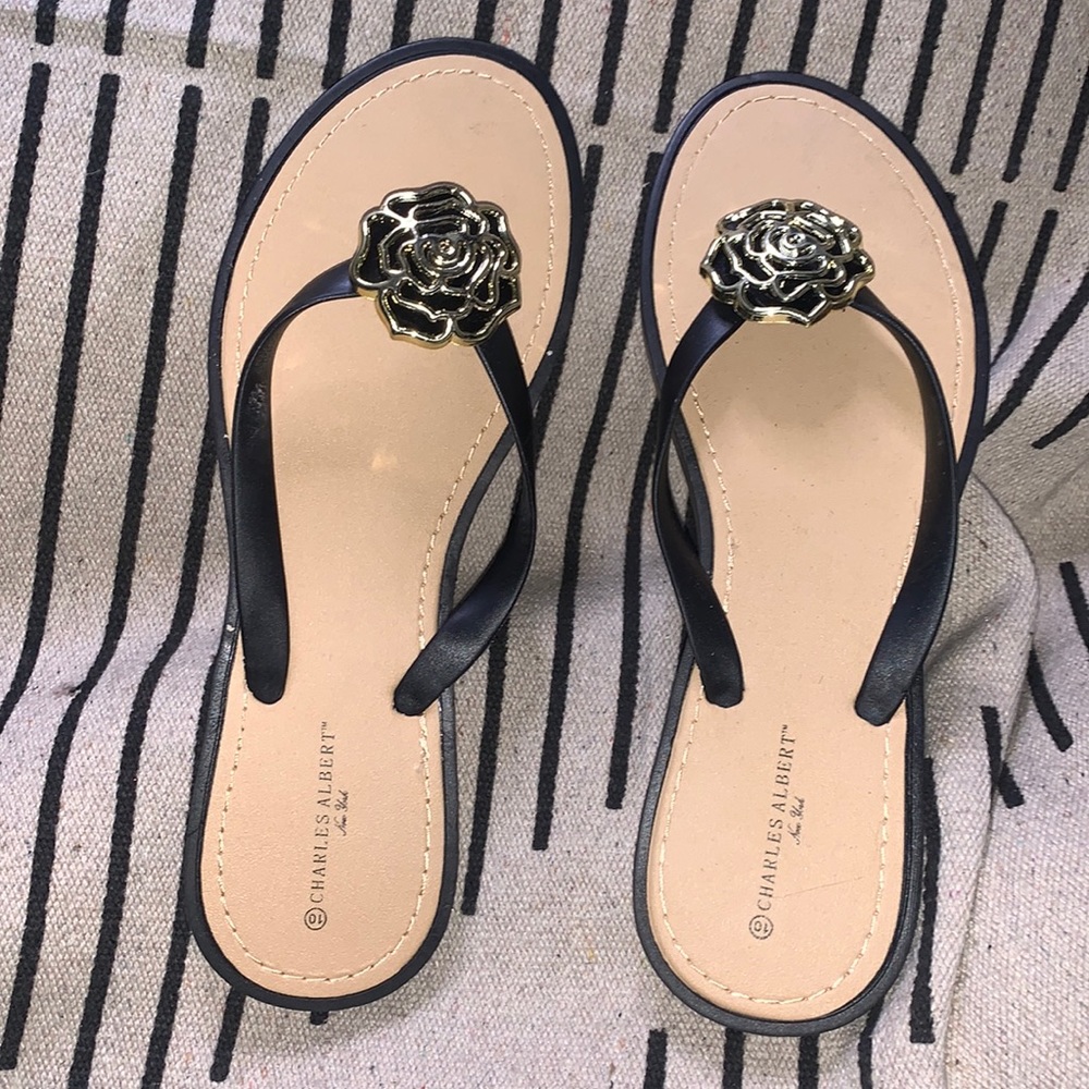 Flip flops with gold flowers on top